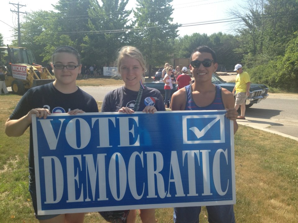 Edie Wilson '14, center, marching for Organizing for America.